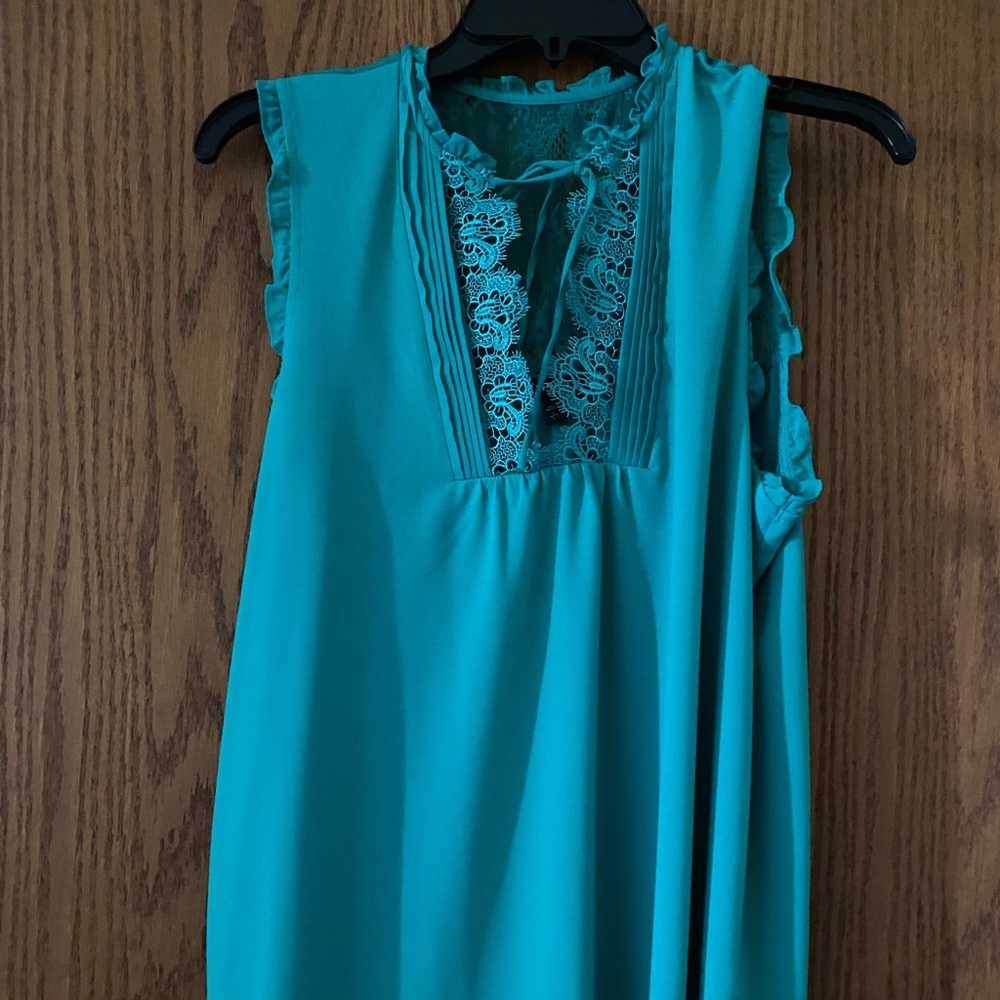 Express Emerald green lacy top. Ties at the top, lacy back